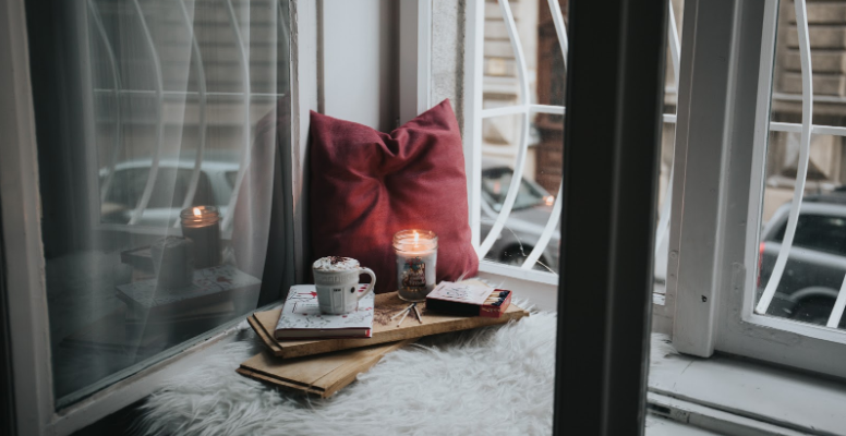 A cozy setting in front of a window