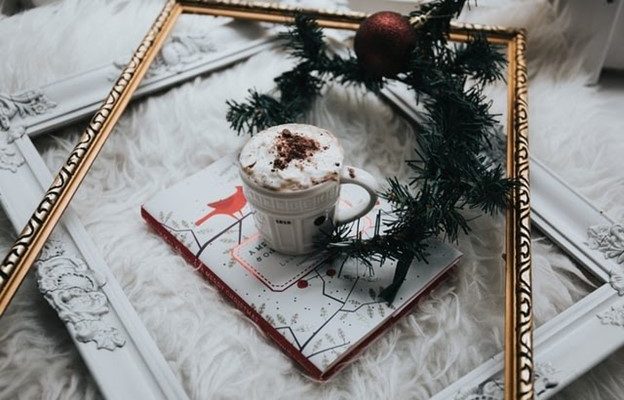 Hot Cocoa atop a Xmas book