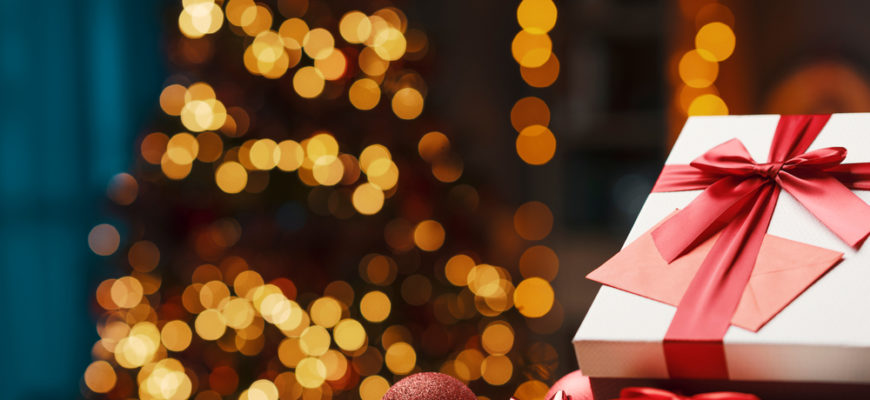 Beautiful,Christmas,Gifts,On,A,Table,At,Home,And,Tree
