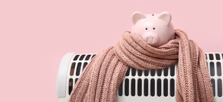 Electric,Convector,Heater,,Piggy,Bank,And,Scarf,On,Pink,Background.